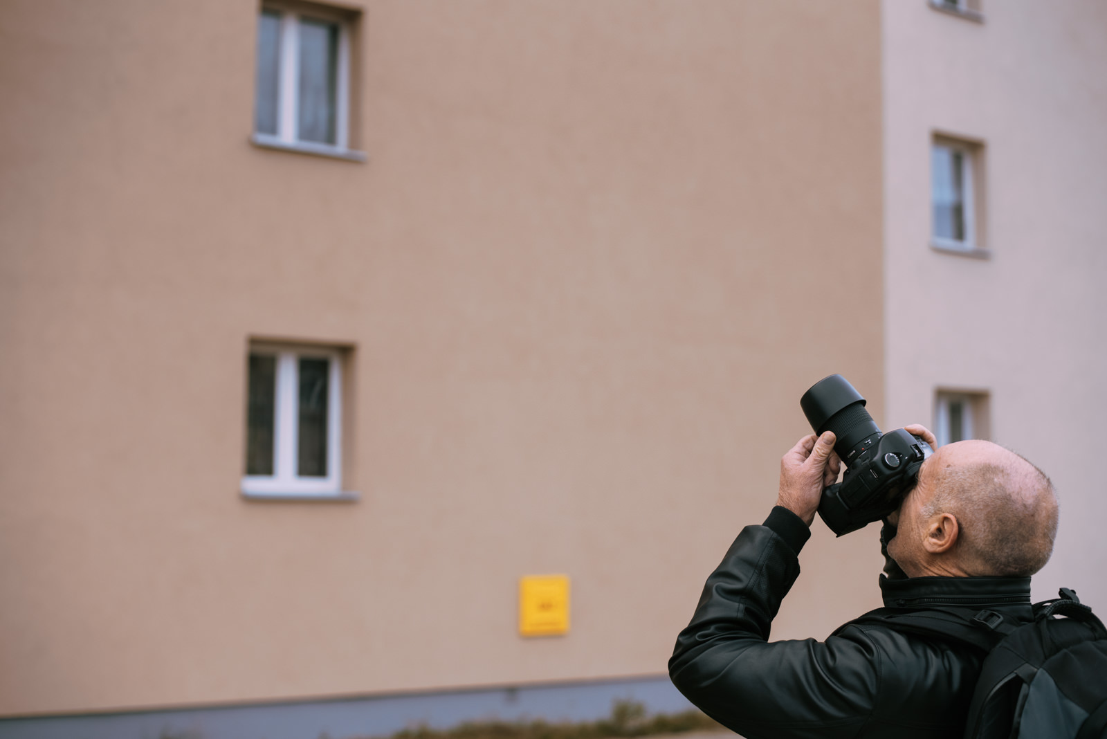 A man shooting with a DSLR