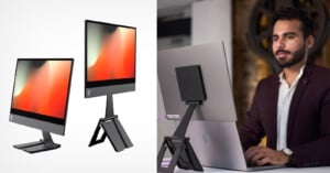 Two sleek desktop monitors with minimal bezels on adjustable stands next to an image of a person using a laptop. The person wears a dark blazer and is focused on the screen.