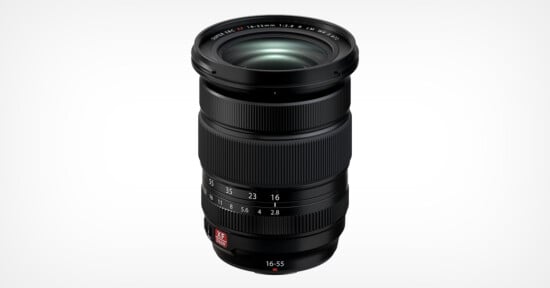 A black camera lens with focal length markings of 16-55mm, featuring a textured grip and a zoom ring. The lens has a metallic logo near the base and is positioned vertically against a plain white background.