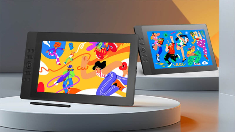 Two digital drawing tablets are displayed on round podiums against a modern, geometric background. Each screen shows vibrant, colorful illustrations featuring abstract figures and dynamic shapes, with a stylus resting beside one tablet.