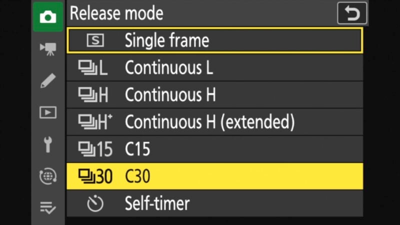 Camera settings menu displaying various release modes: Single frame, Continuous L, Continuous H, Continuous H (extended), C15, C30, and Self-timer. "Single frame" is highlighted in yellow.