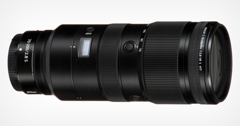 A black Nikon 70-200mm f/2.8 S lens, designed for Nikon Z series cameras, is shown in a horizontal position against a plain white background. The lens features various control rings and buttons for focusing and zoom adjustments.