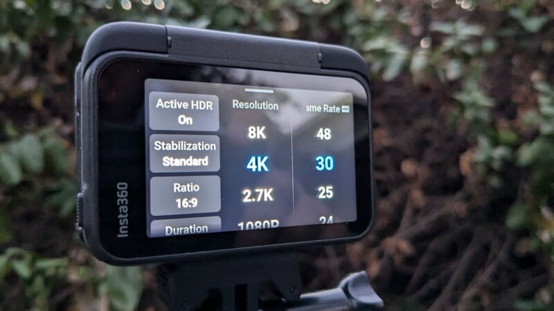 Close-up of a camera screen displaying settings. The resolution is set to 4K at 30 frames per second. Active HDR is on, with stabilization set to standard. Other options visible include 8K, 2.7K, and various frame rates.