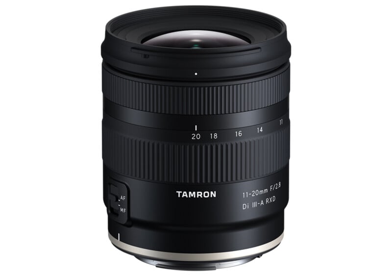 A black Tamron 11-20mm F/2.8 Di III-A RXD camera lens with a textured focus ring and AF/MF switch is positioned upright against a plain white background. Its brand name and specifications are clearly visible on the body.