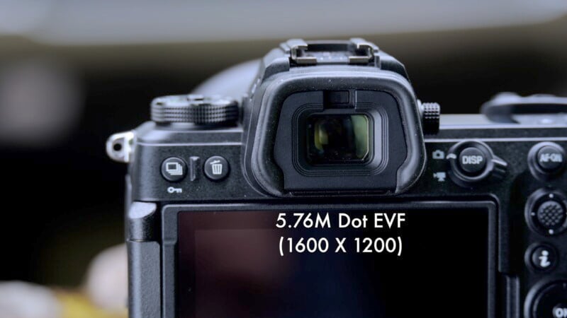 Close-up view of a digital camera's viewfinder, focusing on the electronic viewfinder (EVF) with text overlaying the screen that reads "5.7M Dot EVF (1600 X 1200)." The camera controls and buttons are partially visible.